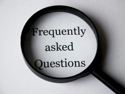 Magnifying glass over the words "Frequently Asked Questions"