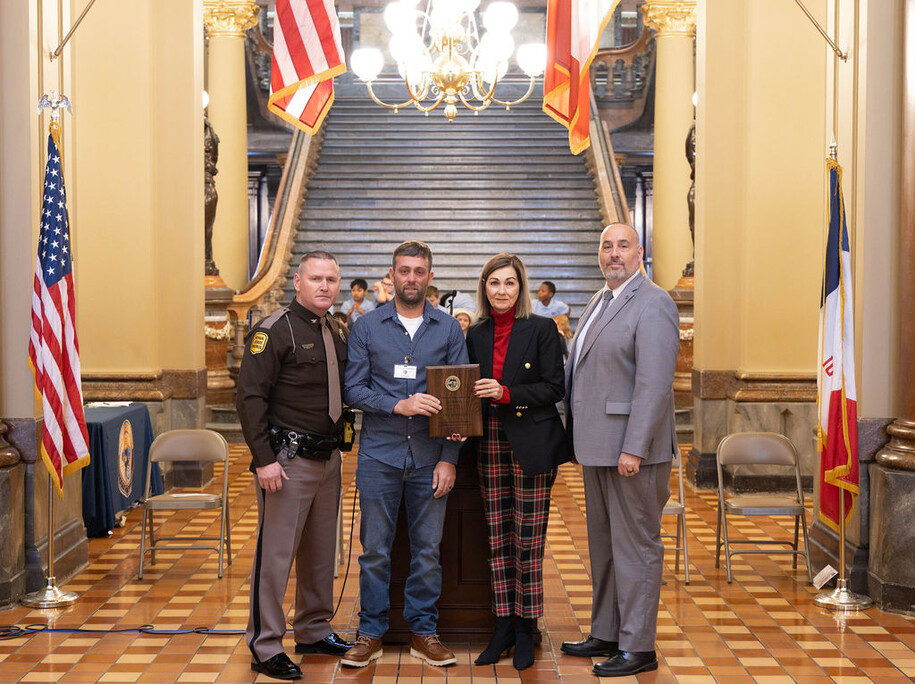 Photo of Kyle Peterson accepting his award