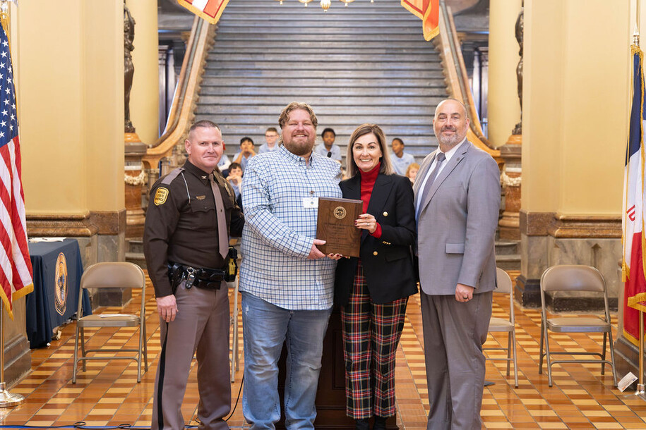 Photo of John Wonio accepting his award